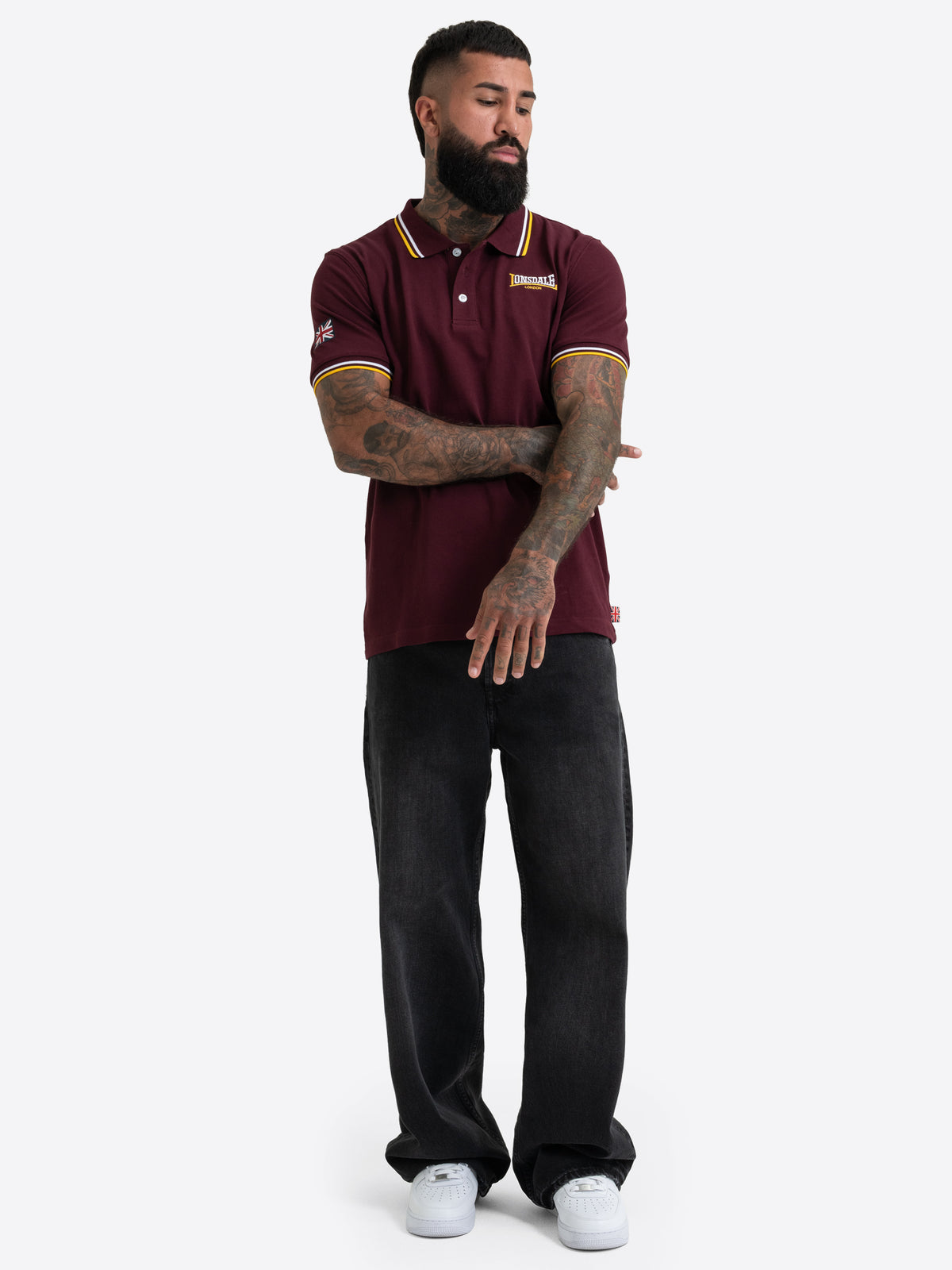 Lonsdale Herren-Poloshirt in Oxblood mit kleinem gesticktem Logo auf der Brust.

