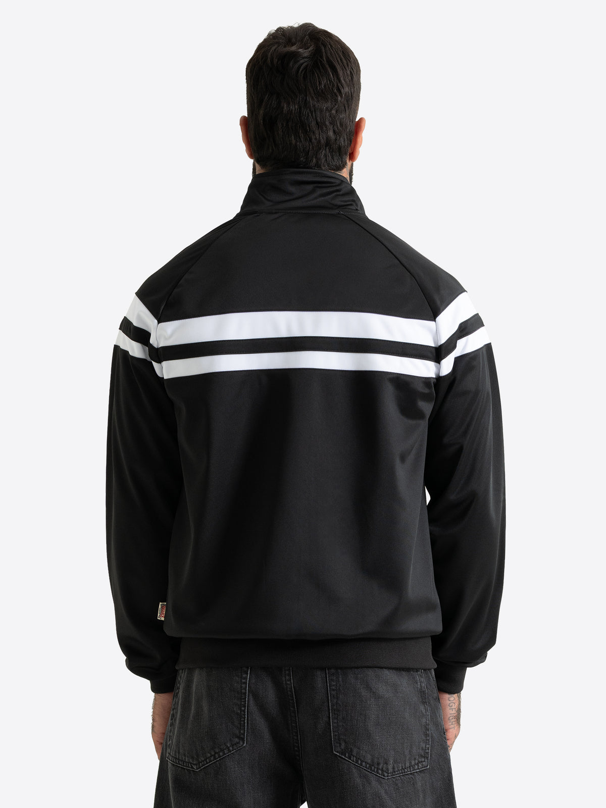 Rückansicht der schwarzen Lonsdale Herren-Trainingsjacke mit Raglanärmeln und durchgehenden weissen Kontraststreifen.
