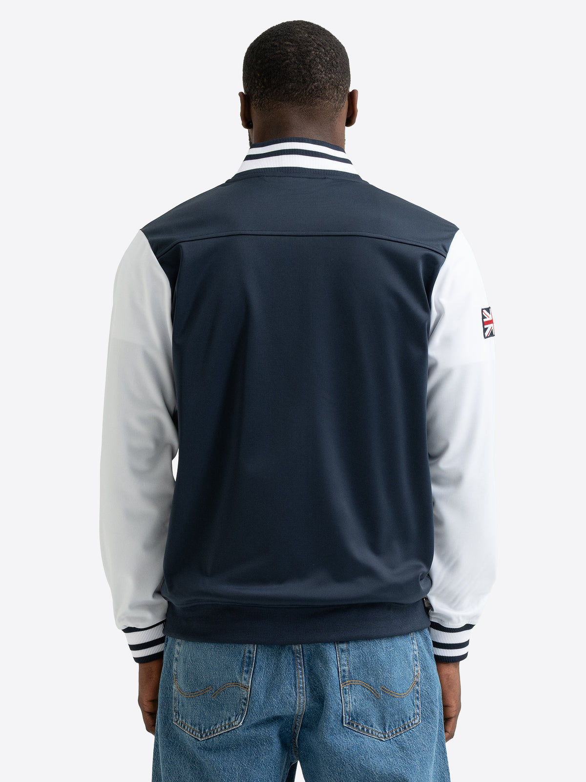 Rueckansicht der Lonsdale Herren Trainingsjacke in Darknavy und Weiss mit gestreiftem Kragen