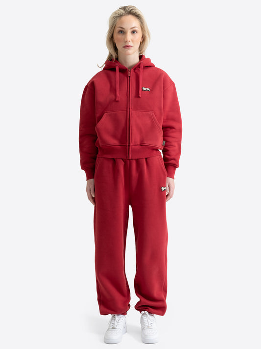 Granatroter Lonsdale London Damen-Jogginganzug mit Kapuzenjacke, Sporthose und ecrufarbenem Loewen-Badge.