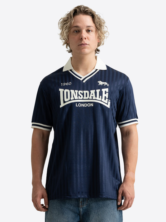 Dunkelblaues Lonsdale Trikot mit weissem Polokragen und grossem Logo-Aufdruck auf der Brust.