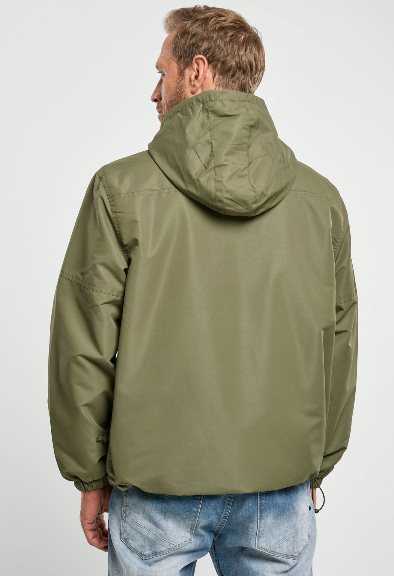 Outdoor-Jacke in Oliv mit Kapuze, Mesh-Futter, Brust- und Seitentaschen, Zipp-Pullern und Lüftungsöffnung.