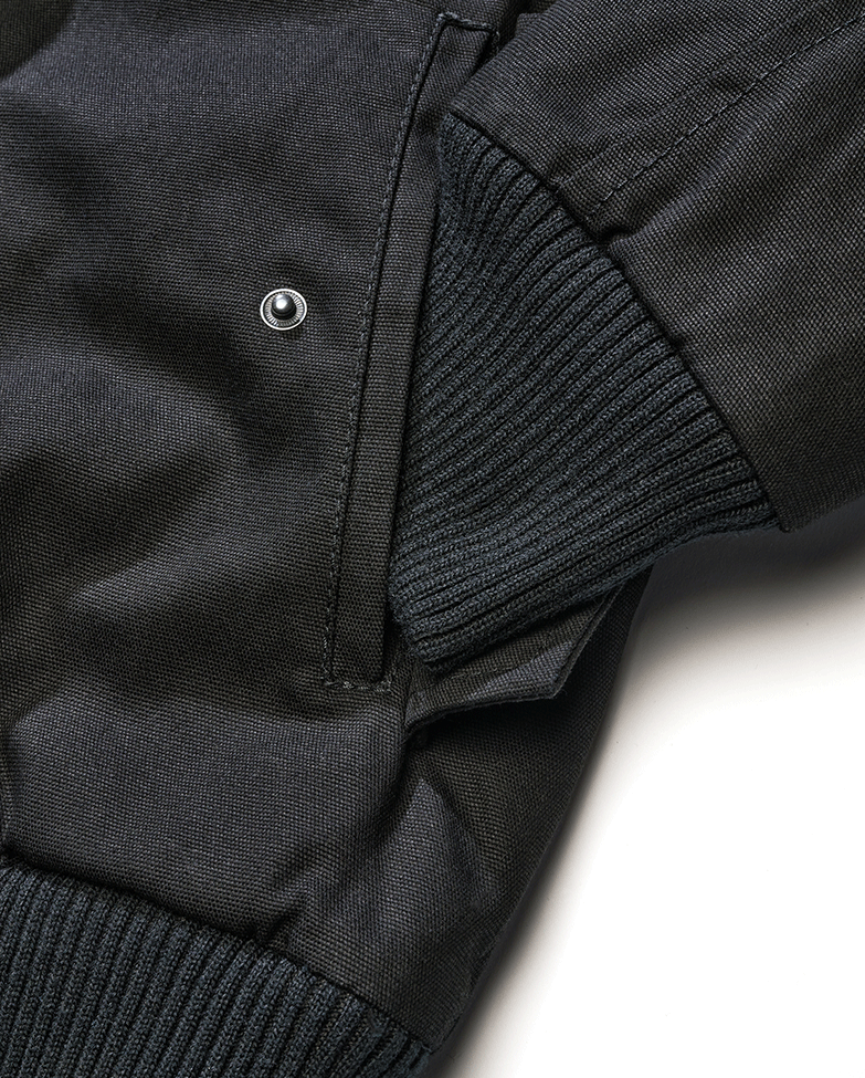 Brandit Kurzjacke in Schwarz – robustes Canvas, Kapuze mit Kordelzug, Teddyfellfutter und praktische Taschen für stylischen Komfort