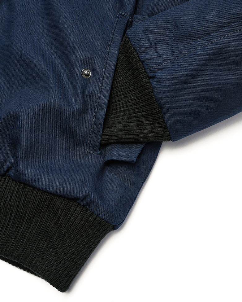 Brandit Kurzjacke Navy aus robustem Canvas mit Kapuze, Kordelzug, Teddyfellfutter und praktischen Taschen