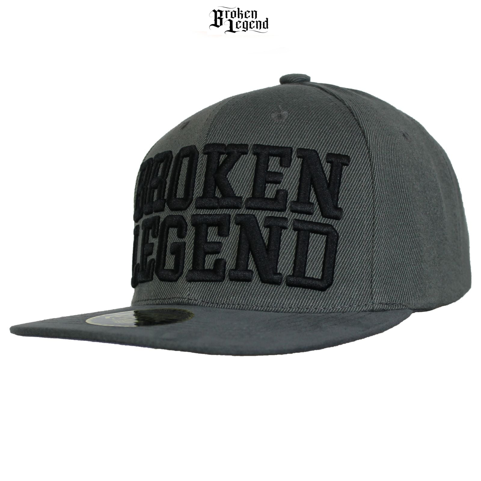 Dunkelgraue Broken Legend Snapback mit grossem 3D-Schriftzug und geradem Schild.